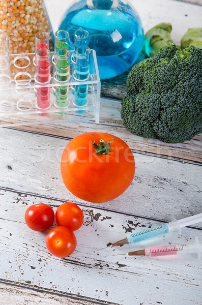 Syringe and tomato. Genetically modified food concept Stock photo © simpson33