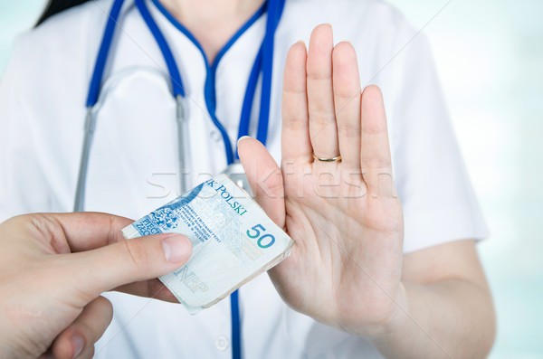 Polish woman doctor refusing kickbacks or bribes. Stock photo © simpson33