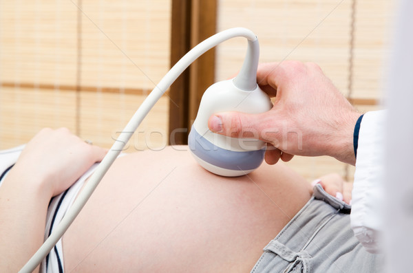 Doctor holding ultrasound transducer. USG machine closeup Stock photo © simpson33