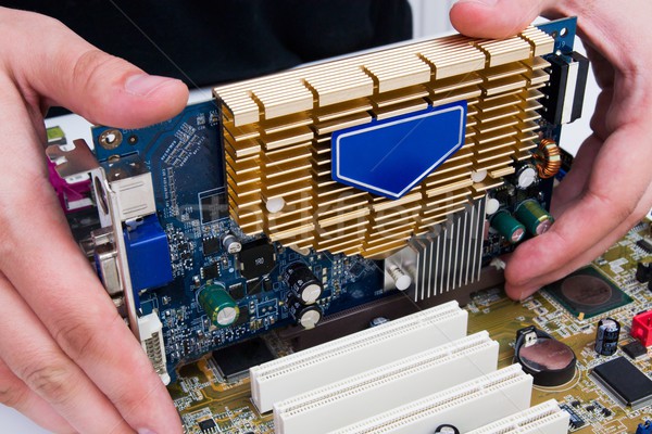 Man install GPU hardware. PC motherboard upgrade Stock photo © simpson33