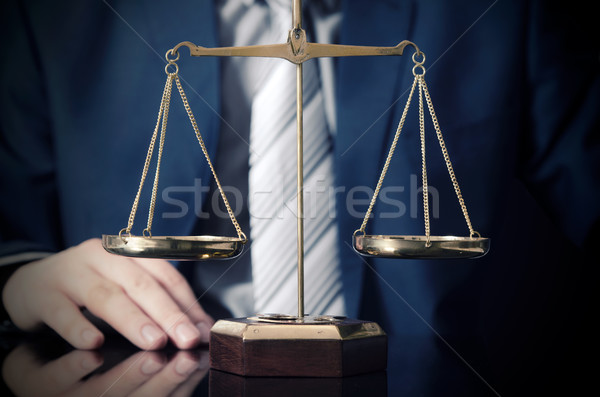 Weight scale of justice, lawyer in background Stock photo © simpson33