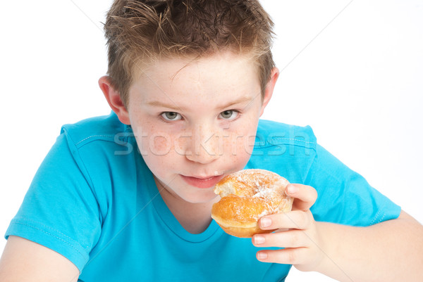 Youny boy eating a sugary doughnut.  Stock photo © SLP_London