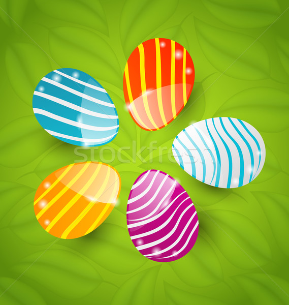 Easter set colorful ornamental eggs on green leaves background Stock photo © smeagorl