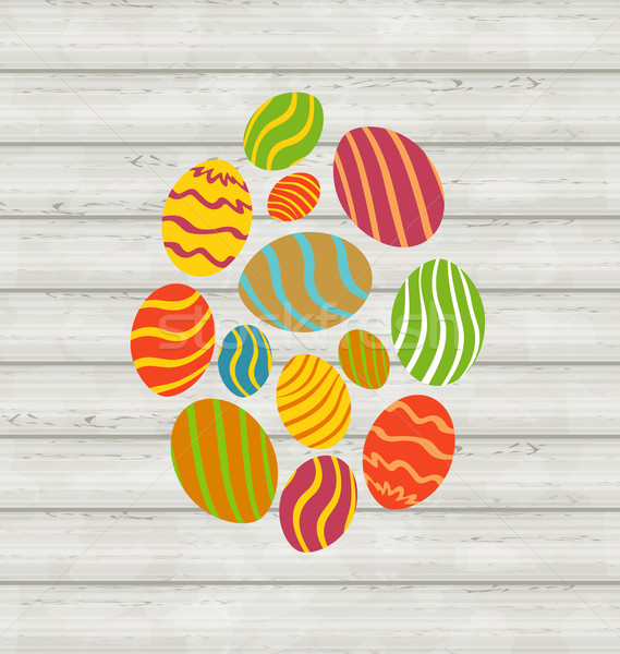 Easter ornamental eggs on wooden background Stock photo © smeagorl