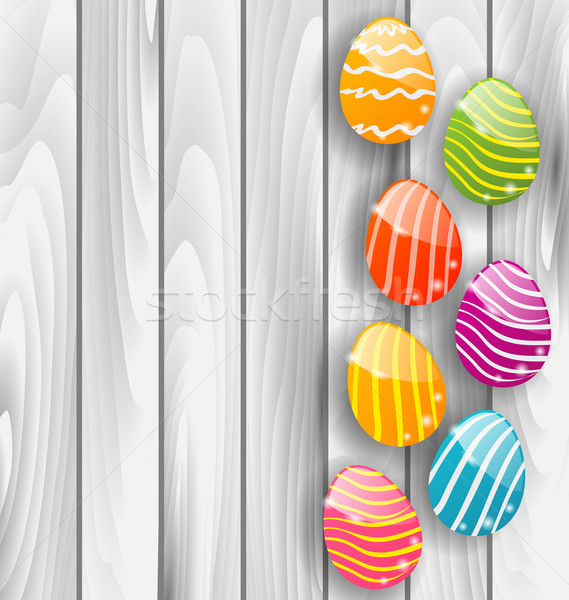 Stock photo: Easter glossy colorful eggs on grey wooden texture