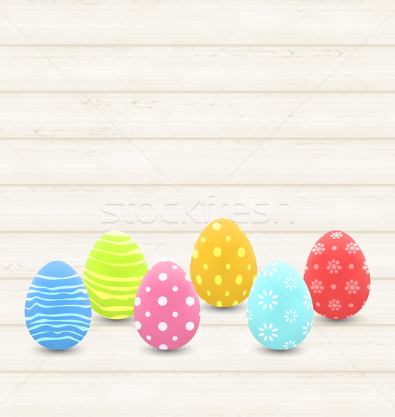 wooden background with colorful traditional eggs for Easter Stock photo © smeagorl