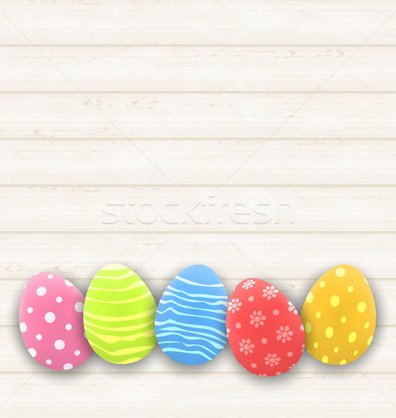 Easter colorful eggs on wooden texture Stock photo © smeagorl
