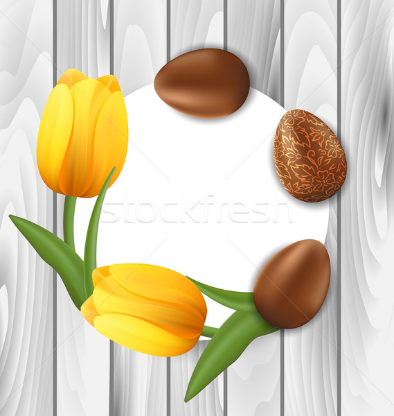Greeting Card with Easter Chocolate Eggs and Yellow Tulips Flowe Stock photo © smeagorl