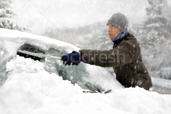 Man removes snow from his car Stock photo © Smileus
