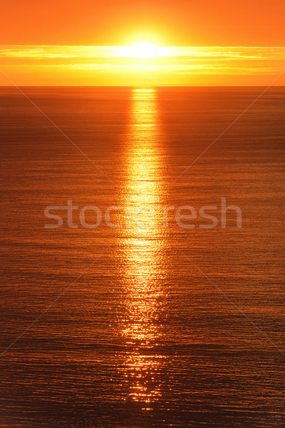 Sunrise reflected on the ocean Stock photo © Smileus