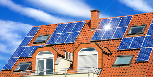 Solar panel on a red roof Stock photo © Smileus