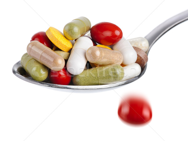Spoon piled with pills Stock photo © Smileus
