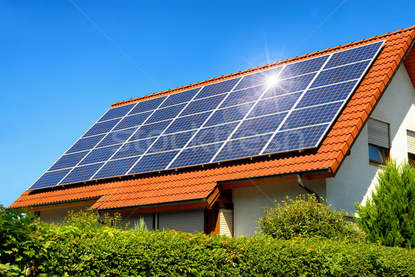 Solar panel on a red roof Stock photo © Smileus