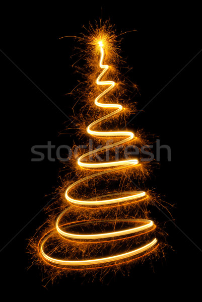 Nice Christmas tree drawn with sparkling light Stock photo © Smileus