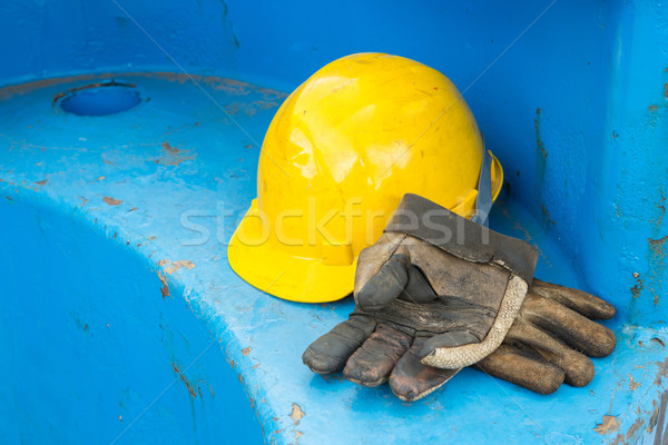 Dirty leather gloves and safety helmet Stock photo © smuay