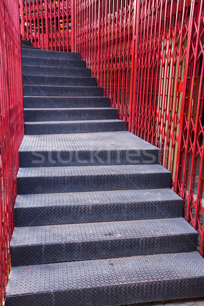 Black staircase and red fence Stock photo © smuay