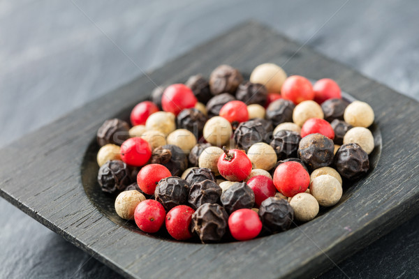 Colorful peppercorn in wooden bowl Stock photo © smuay