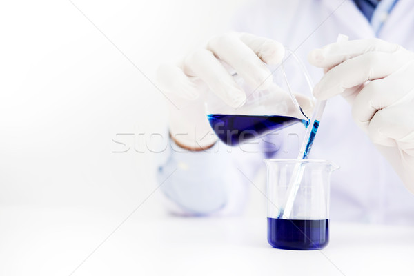 scientists and scientific equipment Pouring mixing reagents liqi Stock photo © snowing