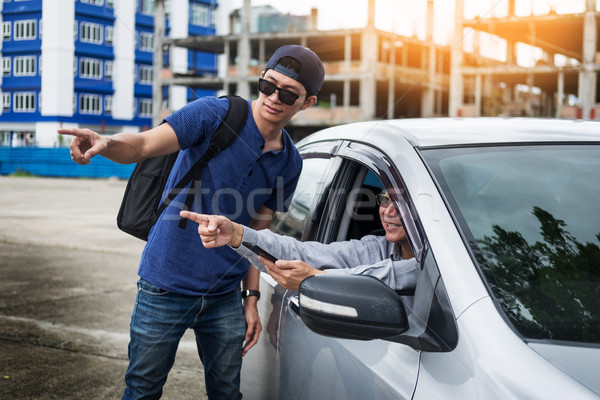 tourists or traveler seek advice map with smart phone from taxi  Stock photo © snowing