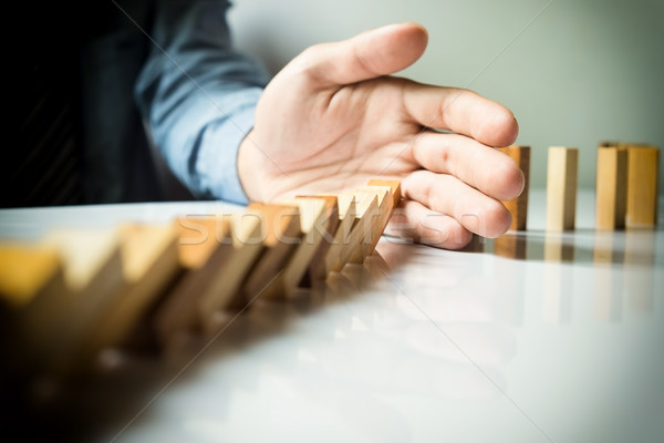 Stock photo: businessman hand stop dominoes continuous toppled or risk with c