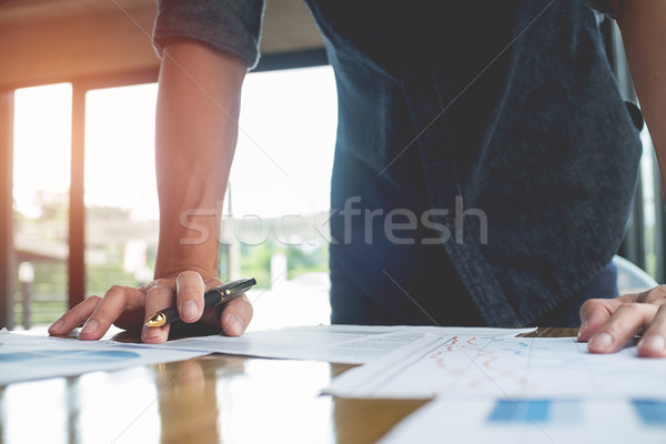 Photo work process banker.Man working wood table with new busine Stock photo © snowing