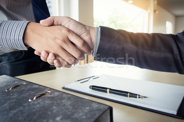 Midsection of a businessman shaking hands with a cropped female  Stock photo © snowing