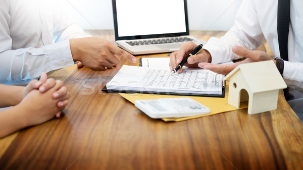 Real estate agent to present the property (house) to customer Stock photo © snowing