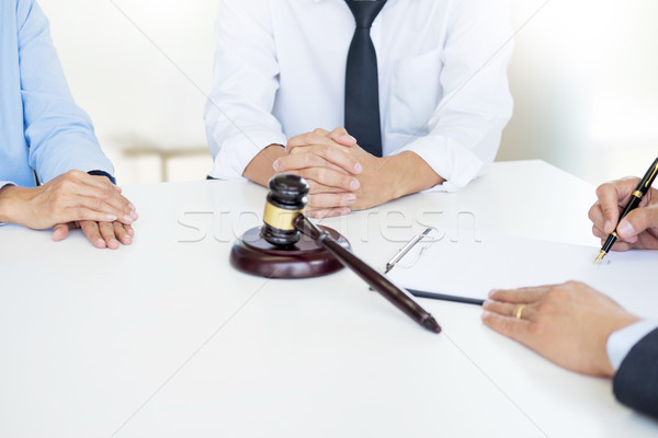 Angry couple arguing telling their problems to Judge gavel decid Stock photo © snowing