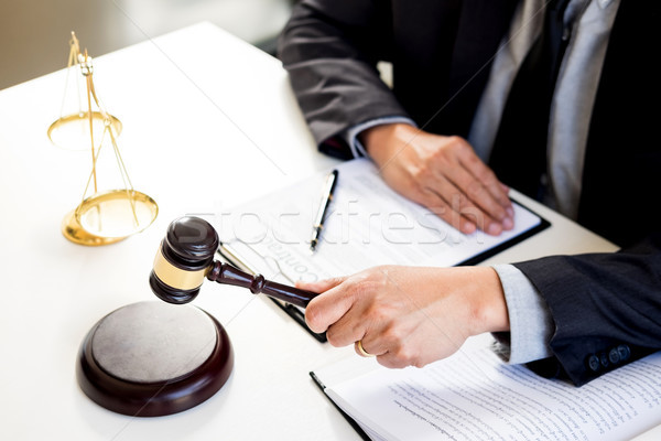 Male Judge lawyer In A Courtroom Striking The Gavel on sounding  Stock photo © snowing