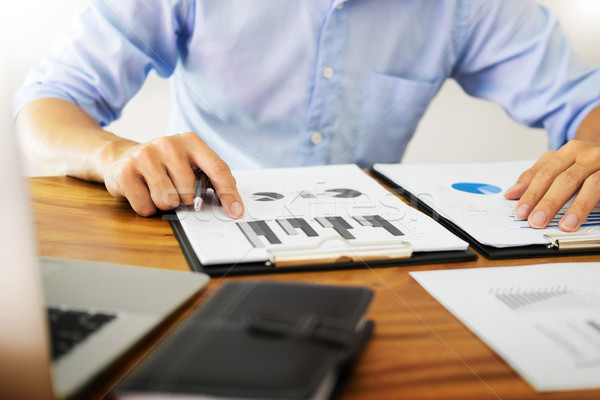 business men working on wooden desk(table) with notebook compute Stock photo © snowing