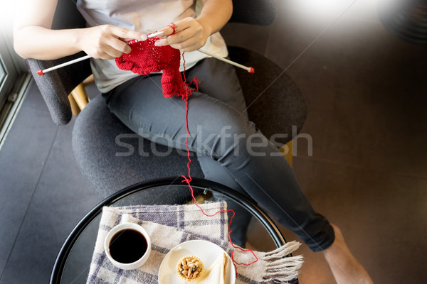 young woman’s hands knitting warm sweaters. Sitting on old arm Stock photo © snowing