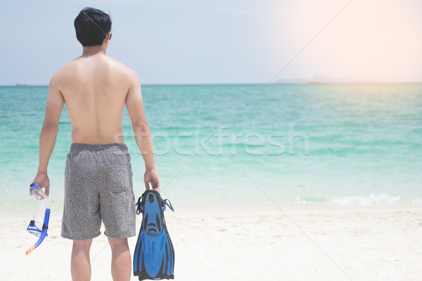 Vacation Backside of man holding snorkeling gear on tropical on  Stock photo © snowing