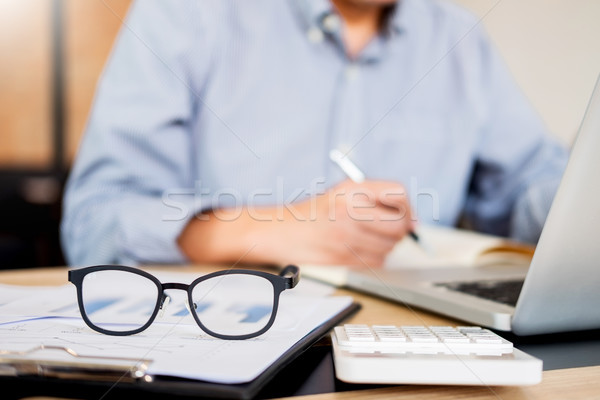 business men working on wooden desk(table) with notebook compute Stock photo © snowing