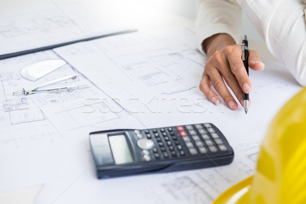 Close-up Of Person's engineer Hand Drawing Plan On Blue Print wi Stock photo © snowing