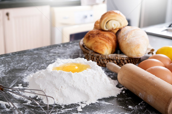 Woman's hands knead dough with flour, eggs and ingredients. at k Stock photo © snowing