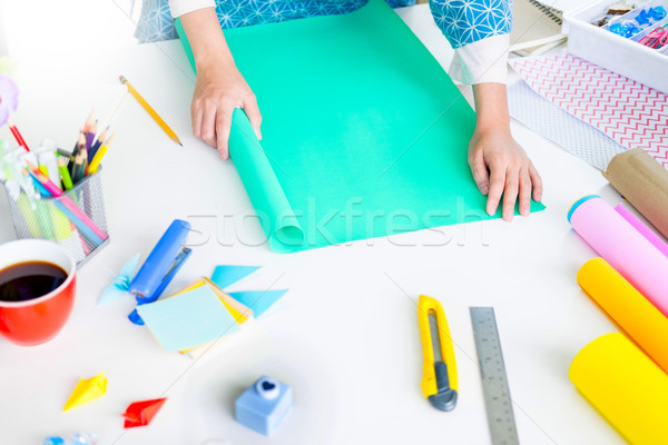Woman's hand cut paper Making a scrap booking or other festive d Stock photo © snowing
