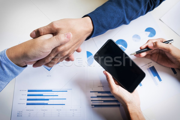 Business handshake of two men demonstrating their agreement to s Stock photo © snowing