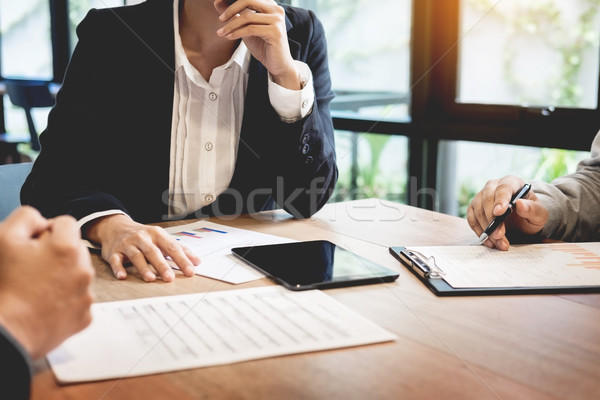 Businessman team working at office desk and using a digital comp Stock photo © snowing