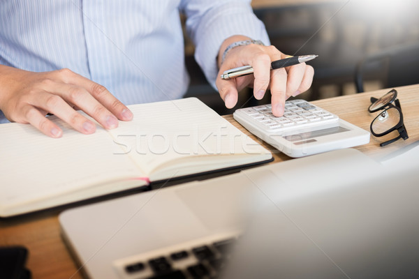 business men working on wooden desk(table) with notebook compute Stock photo © snowing