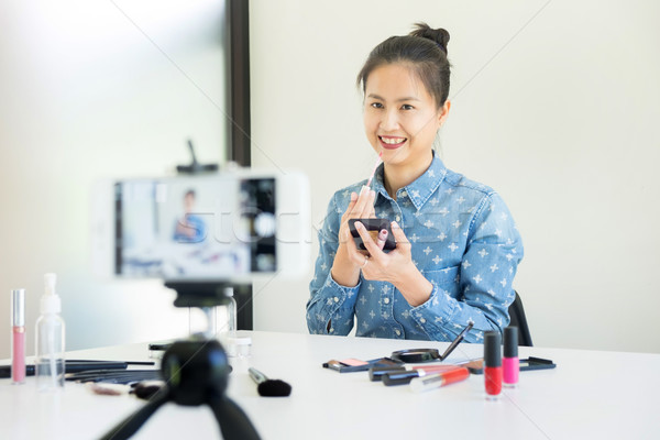 woman present beauty product and broadcast live video to social  Stock photo © snowing