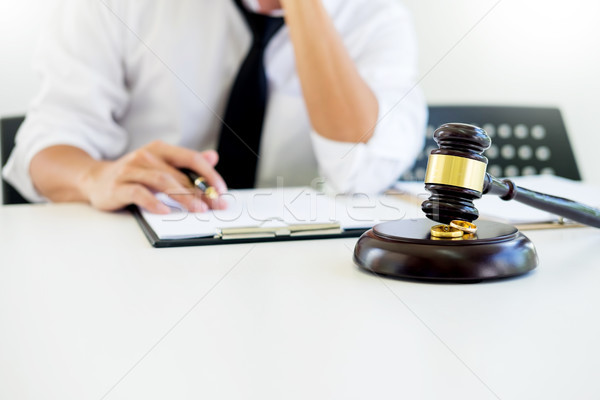 Angry couple arguing telling their problems to Judge gavel decid Stock photo © snowing