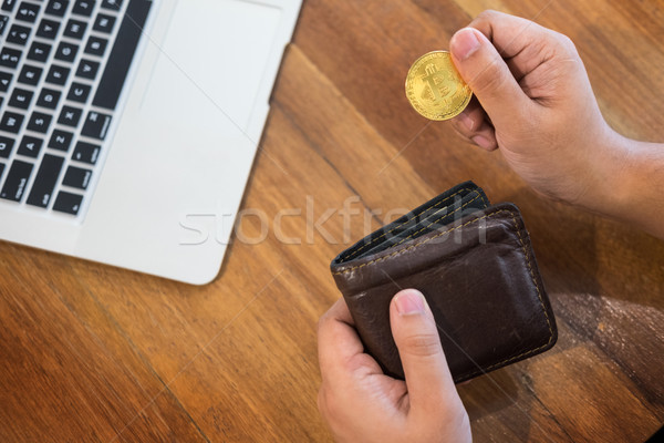 hand with golden metal Bitcoin crypto currency investment- symbo Stock photo © snowing