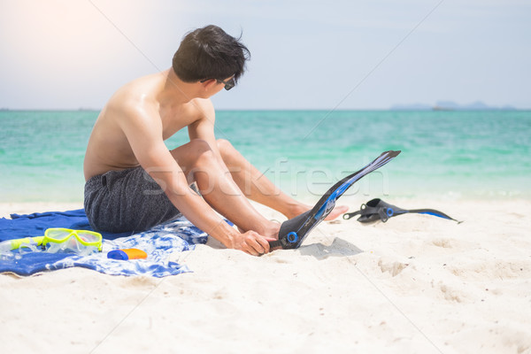 Vacation Backside of man holding snorkeling gear on tropical on  Stock photo © snowing