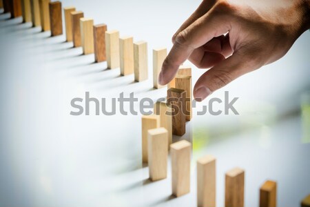 Finger like a business man and wooden block like reached an impa Stock photo © snowing