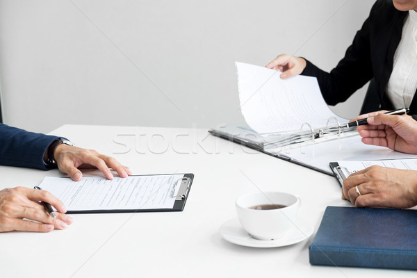 Businessman conducting an interview with businessman in an offic Stock photo © snowing
