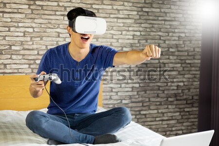 The VR headset design is generic and no logos, Man wearing virtu Stock photo © snowing