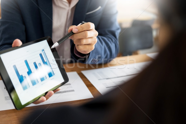 Business man and woman discuss about the financial plan on digit Stock photo © snowing