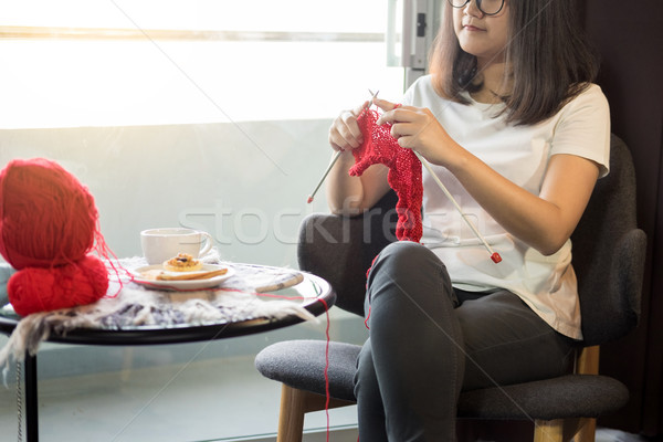 young woman’s hands knitting warm sweaters. Sitting on old arm Stock photo © snowing