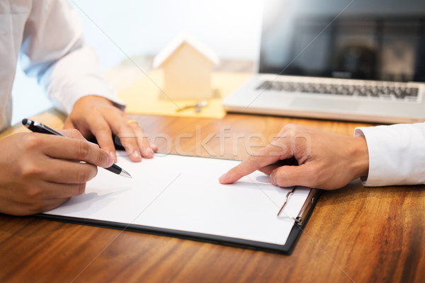 customer signing contract, agreed terms and approved application Stock photo © snowing