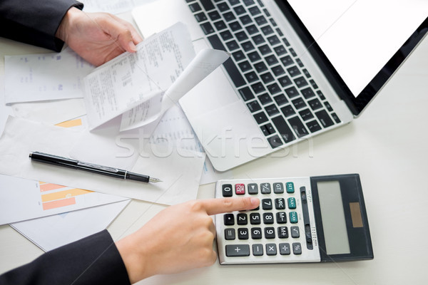 business woman accountant or banker making calculations Bills. d Stock photo © snowing